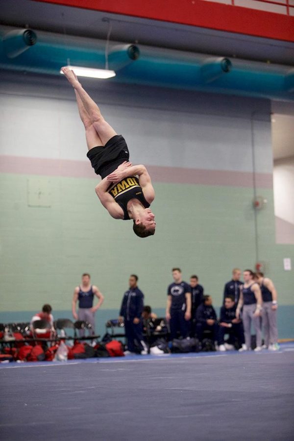Iowa gymnast Jake Brodarzon performs his floor routine at the Feild House, Saturday, Feb. 27. The Hawkeyes, ranked No. 7, beat the No. 6 Nebraska and No. 8 Penn State. 