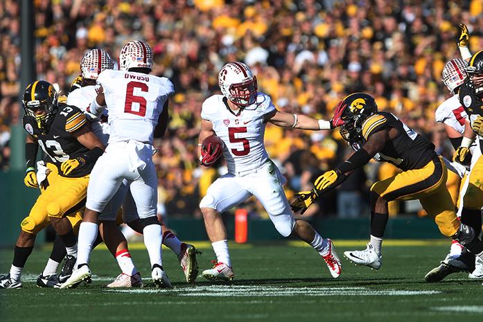 Stanford running back Christian McCaffrey rushes the ball during the Rose Bowl Game in Rose Bowl Stadium in Pasadena, California on Friday, Jan. 1, 2016. McCaffrey rushed for 172 yards. Stanford defeated Iowa, 45-16. (The Daily Iowan/Alyssa Hitchcock)