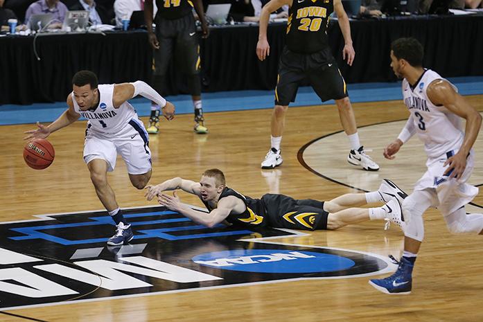 Villanova Wildcats guard Jalen Brunson (1) runs downcourt after Iowa Hawkeyes guard Mike Gesell (10) turned the ball over in the Barclays Center on Sunday, March 20, 2016 in Brooklyn, New York. Brunson ended the game with 3 rebounds, 12 points, 4 assists, and 1 steal.  The Wildcats defeated the Hawkeyes, 87-68. (The Daily Iowan/Joshua Housing)