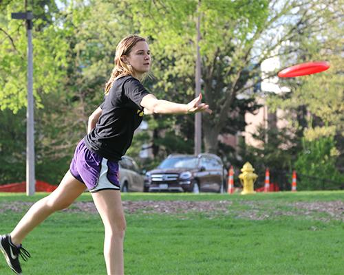 Freshman Rebecca Schwartenburg throws a frisbee at the Quadrangle Courtyard on Tuesday, May 3, 2016. Schwartzenbrug was playing with a group of her friends in lieu of the pleasant change in weather. (The Daily Iowan/Tawny Schmit)
