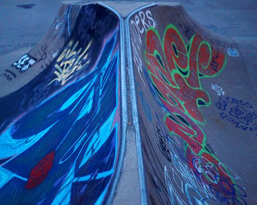 Graffiti decorate the skate ramps at the Iowa City Skate Park on Sunday. The skate park is located in Terrell Mill Park. (The Daily Iowan/Brooklynn Kascel)