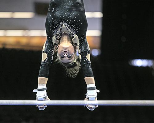 Iowa's Mollie Drenth looks down at the bar during the meet against No. 14 Nebraska on Feb. 7. The Hawkeyes beat the Huskers, 196.650-196.350. (The Daily Iowan/Anthony Vazquez)