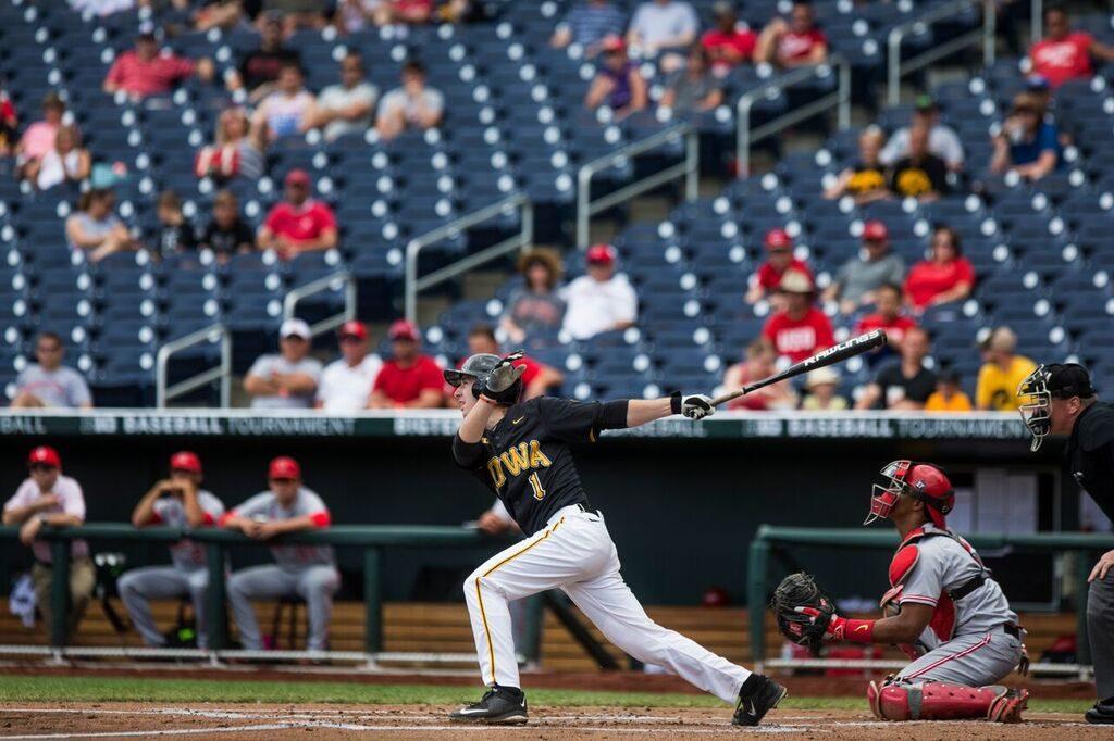 Iowa junior Mason McCoy swings and connects on his game-winning single against Ohio State in the second round of the Big Ten Tournament on May 27 in Omaha, Nebraska. 