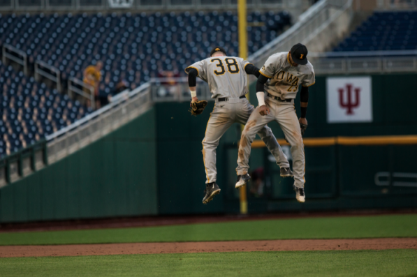 Tyler Peyton and Joel Booker celebrate after Iowa defeated Minnesota 8-2 on May 25 in the first round of the Big Ten Tournament in Omaha, Nebraska.