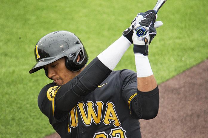 Iowa no. 23, Joel Booker warms up during a baseball game at the Duane Banks Field, Sunday, April 10, 2016. Iowa won over Illinois, 4-3. (The Daily Iowan/Ting Xuan Tan)