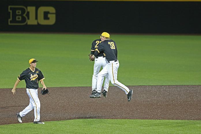 Iowa outfielder Joel Booker and first baseman Tyler Peyton celebrate at the end of the Iowa-Western Illinois game at Duane Banks Field on May 3, 2016. The Hawkeyes defeated the Leathernecks 10-4. (The Daily Iowan/ Alex Kroeze)