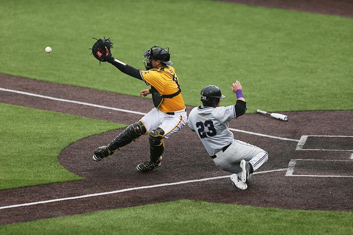 Iowa catcher Daniel Aaron Moriel tries to tag Kansas state first baseman Jake Scudder at home during game three of the Iowa-Kansas State series at Duane Banks field on Sunday, May 1, 2016. The Wildcats defeated the Hawkeyes, 4-2 taking the series. (The Daily Iowan/Margaret Kispert)