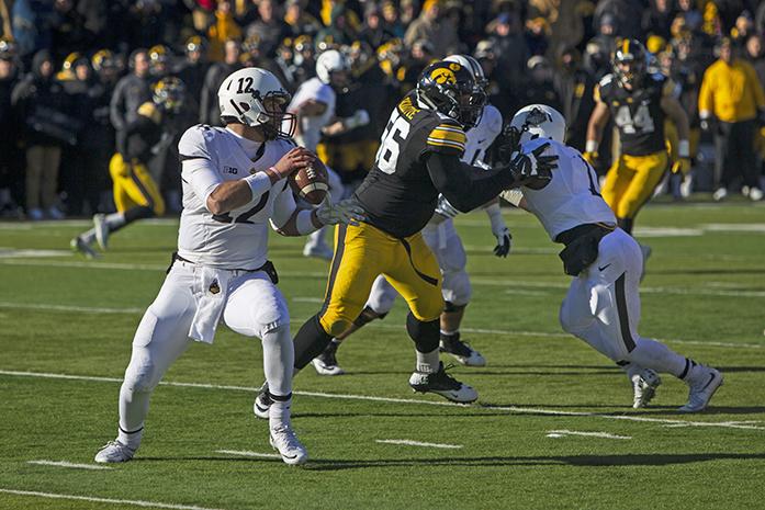 Perdue quarterback Austin Apple attempts to throw the ball  at the Kinnick Stadium on Saturday, Nov. 21, 2015. The Hawkeyes defeated Purdue, 40-20. (The Daily Iowan/Peter Kim)