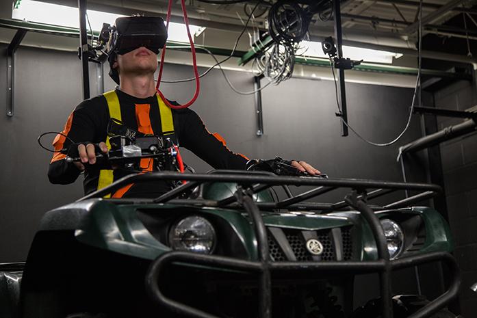 University+of+Iowa+Student+Kyle+Losik+test+drives+the+ATV+Simulator+at+the+Center+of+Computer-Aided+Design+on+Wednesday%2C+June+22%2C+2016.+The+new+ATV+simulator+will+allow+researchers+to+run+tests+simulating+a+variety+of+scenarios+in+a+controlled+environment.+%28The+Daily+Iowan%2FAnthony+Vazquez%29