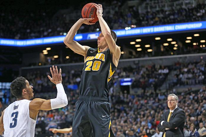 Iowa Hawkeyes forward Jarrod Uthoff (20) shoots a three point shot against Villanova Wildcats guard Josh Hart (3) in the Barclays Center on Sunday, March 20, 2016 in Brooklyn, New York. Uthoff ended the game with 6 rebounds, 16 points, and 2 assists. The Wildcats defeated the Hawkeyes, 87-68. (The Daily Iowan/Joshua Housing)