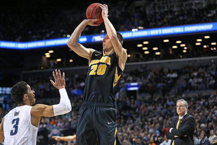 Iowa Hawkeyes forward Jarrod Uthoff (20) shoots a three point shot against Villanova Wildcats guard Josh Hart (3) in the Barclays Center on Sunday, March 20, 2016 in Brooklyn, New York. Uthoff ended the game with 6 rebounds, 16 points, and 2 assists. The Wildcats defeated the Hawkeyes, 87-68. (The Daily Iowan/Joshua Housing)