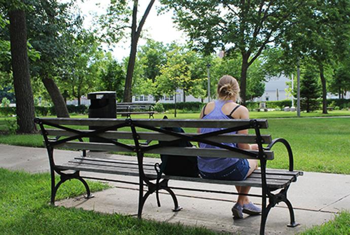 Becky McCormick studies in Gibson Square on Sunday. McCormick is working toward a master’s in international relations at University of Glasgow, Scotland. (The Daily Iowan/McCall Radavich)