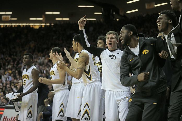 The Iowa bench celebrates after the team scored against Indiana on Tuesday, March 1, 2016 in Carver-Hawkeye in Iowa City, IA. The Hoosiers defeated the Hawkeyes, 81-78. (The Daily Iowan/Joshua Housing)
