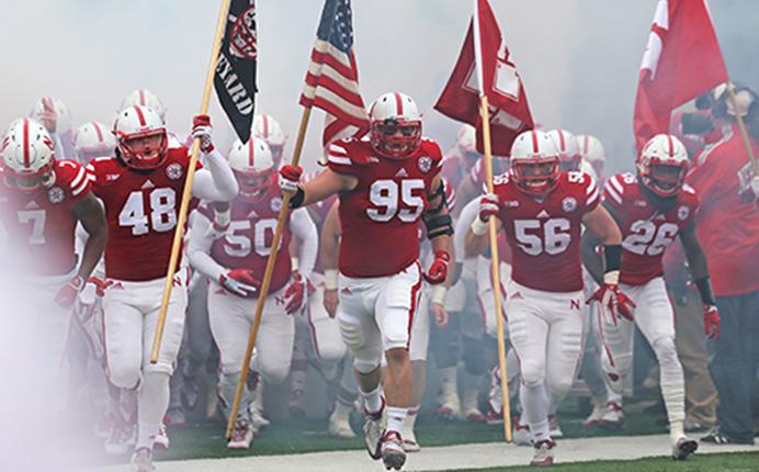 Members of the Nebraska football team run out on the field before the Iowa-Nebraska game at Memorial Stadium onNov. 27, 2015. The Hawkeyes defeated the Cornhuskers, 28-20, to finish off a perfect regular season. (The Daily Iowan/File Photo)