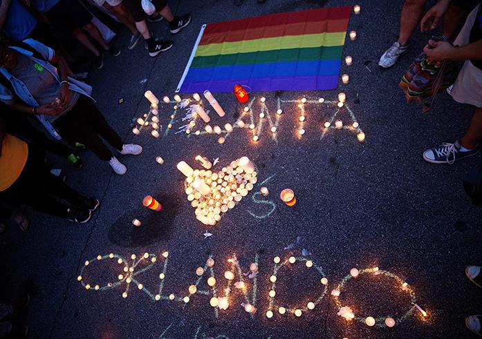 A+message+spelled+out+in+candles+is+laid+out+at+a+vigil+after+a+fatal+shooting+at+an+Orlando+nightclub%2C+Sunday%2C+June+12%2C+2016%2C+in+Atlanta.+%28AP+Photo%2FDavid+Goldman%29