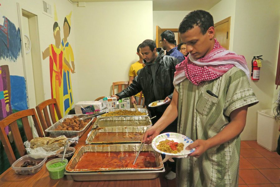 UI junior Abdualrahman Ismail is able to eat after sunset during Ramadan at the Asian Pacific American Cultural Center on Tuesday, June 14, 2016. During Ramadan strict fasting is observed as a way to practice reflection, discipline, and devotion. (The Daily Iowan/Lexi Brunk)