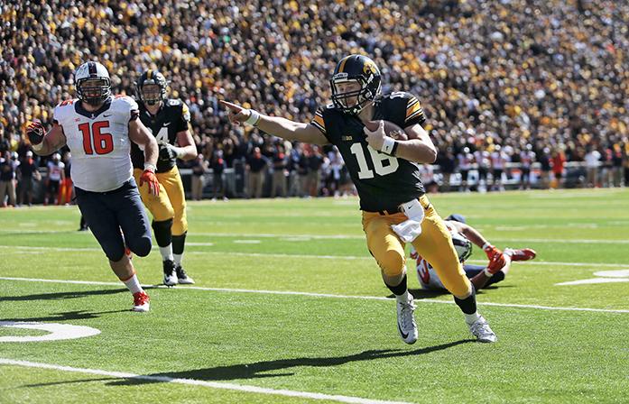 Iowa quarterback CJ Beathard runs with the ball during the Homecoming game against Illinois in Kinnick Stadium on Saturday, Oct. 10, 2015. The Hawkeyes defeated the Illini 29-20. (The Daily Iowan/Valerie Burke)