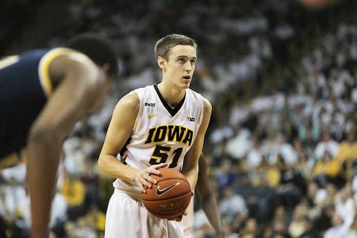 Iowa forward Nicholas Baer shoots a free-throw during the Iowa-Michigan game in Carver-Hawkeye Arena on Sunday, Jan. 17, 2015. The Hawkeyes defeated the Wolverines, 82-71. (The Daily Iowan/Margaret Kispert)