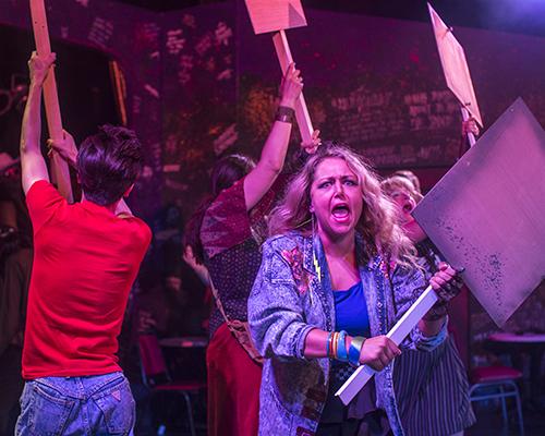 Actors protest the sale of land on the Sunset Strip in the musical Rock of Ages at The Englert Theatre on Tuesday, July 19, 2016.