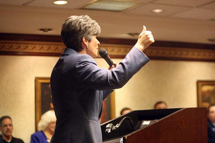Joni Ernst gives her speech at the Iowa Knows Best Tour at the Cedar Rapids Marriott Hotel on Monday, Oct. 13, 2014. Mitt Romney fully supports Joni Ernst and her campaign. (The Daily Iowan/McCall Radavich)