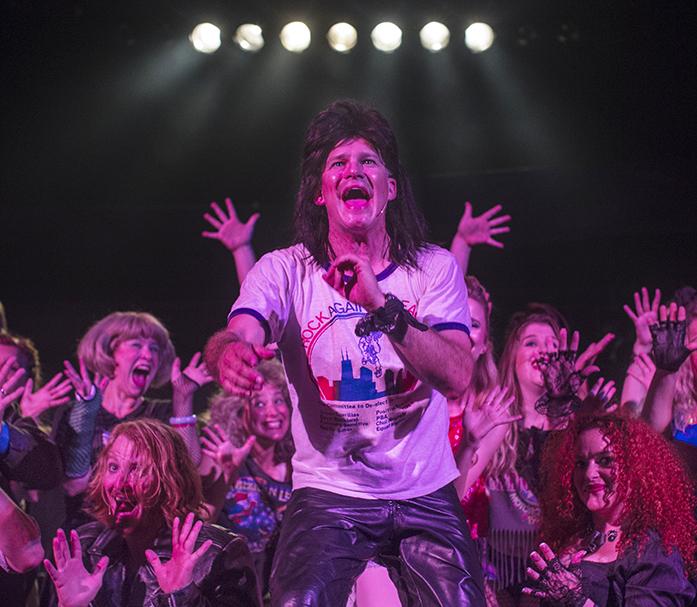 The cast of Rock of Ages gather together on the stage of The Englert Theatre during rehearsal on Tuesday, July 19, 2016.