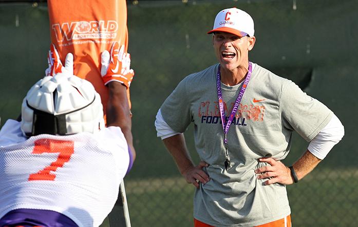 FILE - In this Aug. 1, 2014, file photo, Clemson defensive coordinator Brent Venables yells at linebacker Tony Steward during a drill at the team's opening NCAA college football practice of the season, in Clemson, S.C. It's become an all too familiar scenario for Clemson defensive coordinator Brent Venables _ seeing most of a successful Tiger defense leave and needing to quickly build it back up. (Mark Crammer/The Independent-Mail via AP, File)