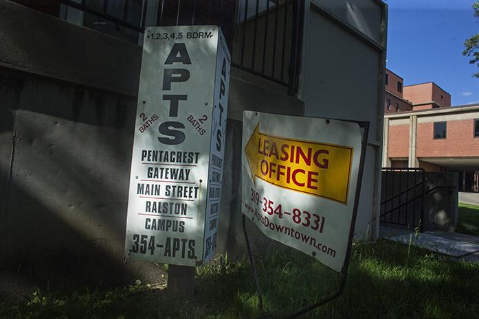 Apartments Downtown yard signs sit outside of their Market Street office on Monday, July 26, 2016. (The Daily Iowan/Joseph Cress)