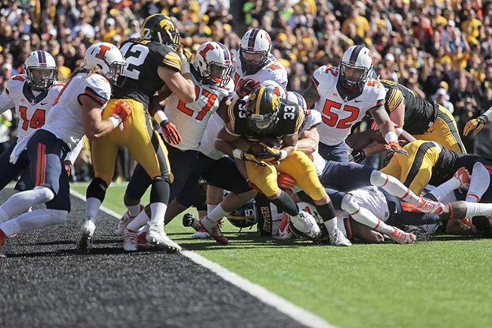 Iowa running back Jordan Canzeri attempts to get into the end zone for a touchdown during the Homecoming game against Illinois in Kinnick Stadium on Saturday, Oct. 10, 2015.  Canzeri had one touchdown and rushed 256 yards. The Hawkeyes defeated the Illini 29-20. (The Daily Iowan/Valerie Burke)