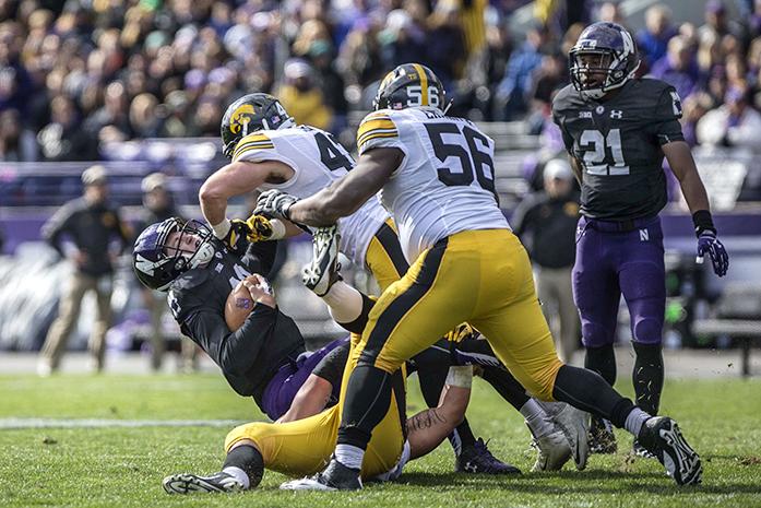 Iowa linebacker Josey Jewell sacks Northwestern quarterback Clayton Thorson during the Iowa-Northwestern game on Saturday, Oct. 17, 2015. The Hawkeyes beat the Wildcats, 40-10. (The Daily Iowan/Sergio Flores)