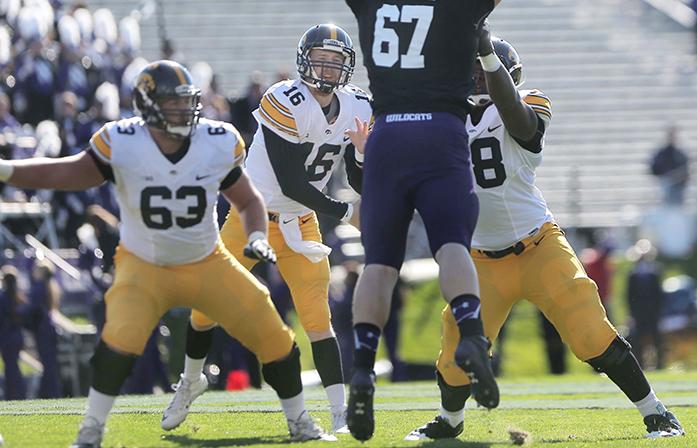 Northwestern+defensive+lineman+Tyler+Lancaster+attempts+to+block+a+pass+made+by+Iowa+quarterback+CJ+Beathard+during+the+Iowa-Northwestern+game+on+Saturday%2C+Oct.+17%2C+2015.+Beathard+had+a+total+of+176+yards+passing.+The+Hawkeyes+beat+the+Wildcats%2C+40-10.+%28The+Daily+Iowan%2FValerie+Burke%29