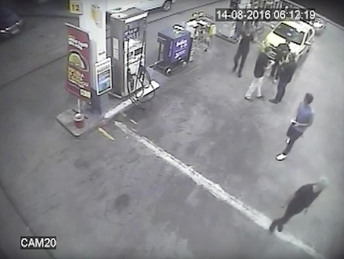 In this Sunday, Aug. 14, 2016 frame from surveillance video released by Brazil Police, swimmers from the United States Olympic team appear with Ryan Lochte, right, at a gas station during the 2016 Summer Olympics in Rio de Janeiro, Brazil. A top Brazil police official said the swimmers damaged property at the gas station. (Brazil Police via AP)