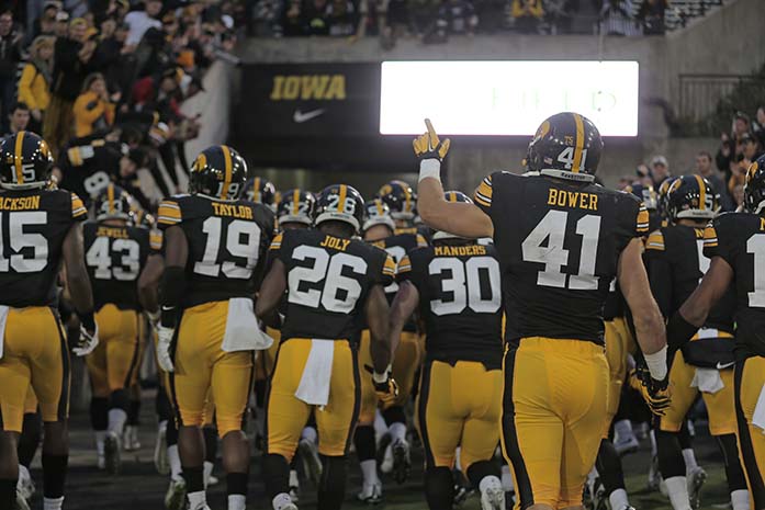 Iowa+line+backer+Bo+Bower+points+to+the+crowd+as+the+team+runs+in+after+the+game+against+Maryland+in+Kinnick+Stadium+on+Oct.+31%2C+2015.+The+Hawkeyes+defeated+the+Terrapins+to+stay+undefeated%2C+31-15.+%28The+Daily+Iowan%2FAlyssa+Hitchcock%29