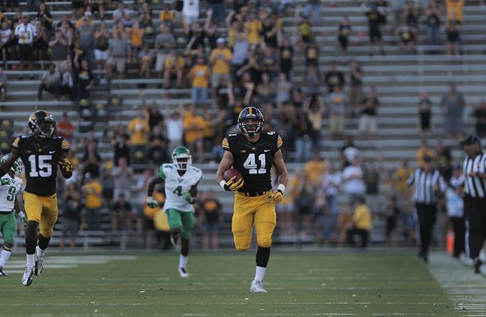 Iowa linebacker Bo Bower runs for 88 yard interception return in the fourth quarter during the Iowa-North Texas game in Kinnick Stadium on Saturday, Sept. 26, 2015. The Hawkeyes defeated the Mean Green, 62-16. (The Daily Iowan/Margaret Kispert)