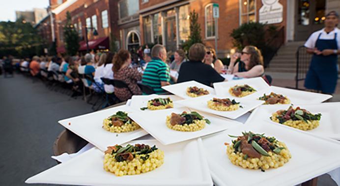 The City of Iowa City and Field to Family put on Iowa City's first annual Farm to Street Dinner on North Linn Street, August 18, 2016. Six different Iowa City restaurants each prepared a meal for the six-course dinner, made only from local farm ingredients and proceeds will go to Field to Family's Farm to School initiative. (The Daily Iowan/Mary Mathis)