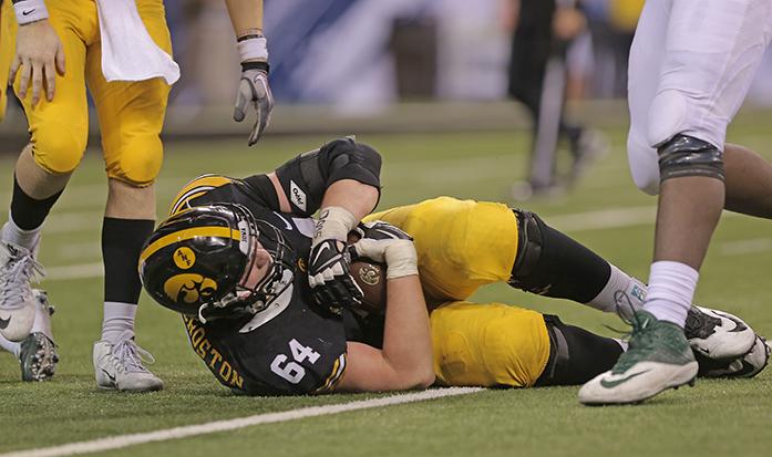 Iowa+offensive+lineman+Cole+Croston+recovers+a+ball+that+was+stripped+from+quarterback+C.J.+Beathard+during+the+Big+Ten+Championship+against+Michigan+State+in+Lucas+Oil+Stadium+in+Indianapolis+on+Saturday%2C+Dec.+5%2C+2015.+The+Spartans+defeated+the+Hawkeyes+in+the+last+seconds+of+the+game%2C+16-13.+%28The+Daily+Iowan%2FMargaret+Kispert%29