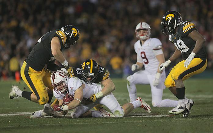 Iowa lineback Josey Jewel tackles Stanford running back Christian McCaffrey during the Rose Bowl Game at Rose Bowl Stadium in Pasadena, California on Friday, Jan. 1, 2016. Stanford defeated Iowa, 45-16. (The Daily Iowan/Margaret Kispert)