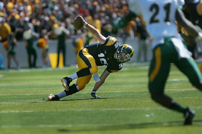 Iowa C.J. Beathard falls backward on a run during the Iowa-NDSU game at Kinnick on Saturday, Sept. 17, 2016. NDSU defeated Iowa in the final seconds of the game with a 37-yard field goal, 23-21. (The Daily Iowan/Margaret Kispert)