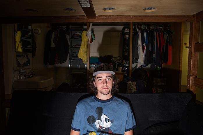 Patrick Luczach sits on his dorm room couch and watches his friends play video games on Monday, Sept, 19. First generation LLC students are currently a minority on the first gen floor of Burge Hall while other first generation students are living in other LLCs. (The Daily Iowan/Jordan Gale)