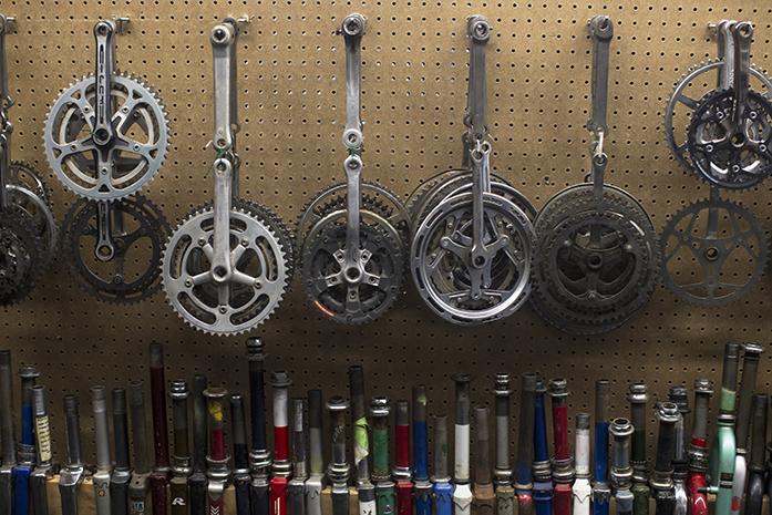 Bike gears and frame parts hang on a peg board inside the new Bike Library on Thursday, Sep. 22, 2016. Today was the grand opening of the new location at 700 S. Dubuque Street in Iowa City. (The Daily Iowan/Brooklynn Kascel)