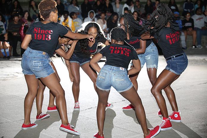 Members of the Delta chapter of Delta Sigma Theta Sorority  Inc. perform during the 1st annual National Pan-Hellenic Council Homecoming Yard Show at the Iowa Memorial Union River Amphitheater on Wednesday, Sept. 28, 2016. This week has been busy for NPHC with the Nebraska Room in the IMU being converted to the NPHC Room and the ribbon cutting for the NPHC plot near Danforth Chapel. (The Daily Iowan/Joshua Housing)