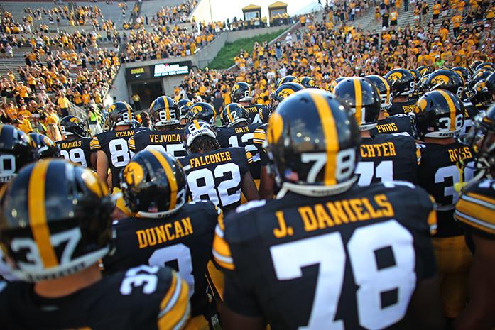 The Iowa team runs off the field after the Iowa-Miami (Ohio) game at Kinnick on Saturday, Sept. 3, 2017. The Hawkeyes defeated the Redhawks, 45-21. (The Daily Iowan/Margaret Kispert)