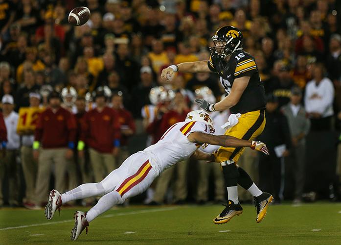 Iowa+quarterback+C.J.+Beathard+gets+the+pass+out+before+Iowa+State+defensive+end+DAndre+Payne+sacks+him+during+the+Iowa-Iowa+State+game+at+Kinnick+on+Saturday%2C+Sept.+10%2C+2016.+Iowa+head+Iowa+State+to+one+field+goal+to+defeated+them%2C+45-3.+%28The+Daily+Iowan%2FMargaret+Kispert%29