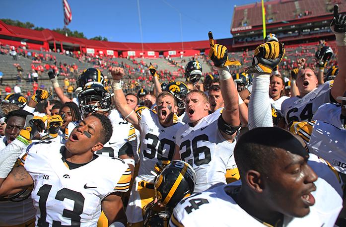 The+Iowa+football+team+signs+the+fight+son+after+the+Iowa-Rutgers+game+at+High+Point+Solution+Stadium+at+Piscataway+on+Saturday%2C+Sept.+24%2C+2016.+The+Hawkeyes+defeated+the+Knights%2C+14-7.+%28The+Daily+Iowan%2FMargaret+Kispert%29