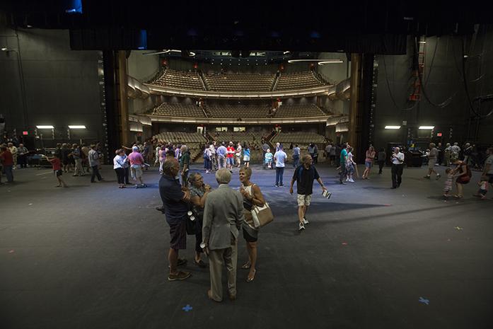 Groups of people walk all over the stage area at the Hancher Auditorium ribbon cutting ceremony and open tour in Iowa City, Iowa on Friday September 9th, 2016. The new Hancher Auditorium is finally open after years of construction and will have its first show on September 24th. (The Daily Iowan/Anthony Vazquez)