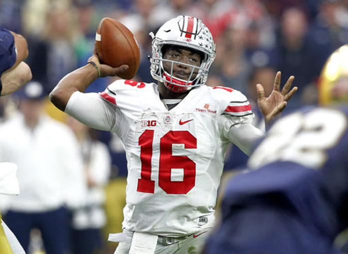FILE - In this Jan. 1, 2016, file photo, Ohio State quarterback J.T. Barrett (16) throws a pass against Notre Dame during the second half of the Fiesta Bowl NCAA College football game in Glendale, Ariz. Last year Ohio State’s offensive engine was powered mostly by All-American tailback Ezekiel Elliott, and the passing game took a back seat. Coach Urban Meyer wants to change that.  (AP Photo/Ross D. Franklin, File)