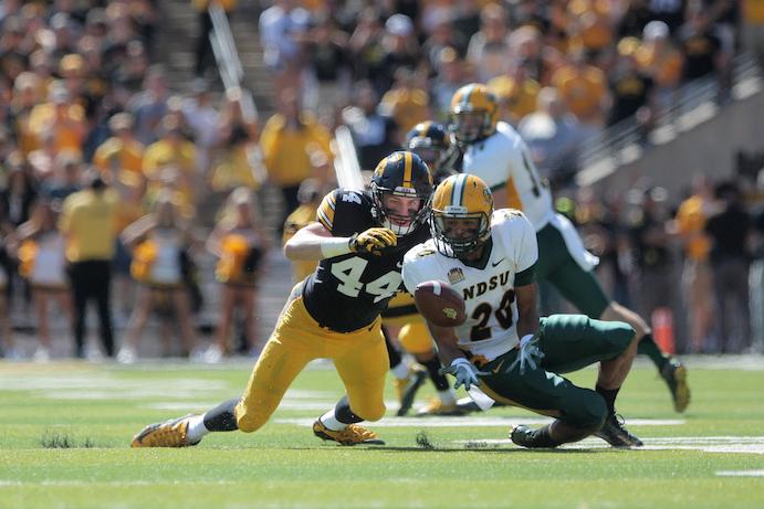 NDSU wide receiver Darrius Shepherd attempts to catch a pass as Iowa linebacker Ben Niemann is defending during the Iowa-NDSU game at Kinnick on Saturday, Sept. 17, 2016. NDSU defeated Iowa in the final seconds of the game with a 37-yard field goal, 23-21. (The Daily Iowan/Margaret Kispert)