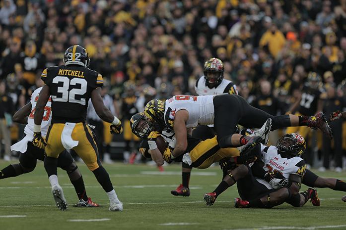 Iowa+wide+receiver+Matt+VanderBerg+gets+tackled+by+a+Maryland+defensive+lineman+during+the+Iowa-Maryland+game+at+Kinnick+Stadium+on+Saturday%2C+Oct.+31%2C+2015.+The+Hawkeyes+defeated+the+Terrapins+to+stay+undefeated%2C+31-15.+%28The+Daily+Iowan%2FMargaret+Kispert%29