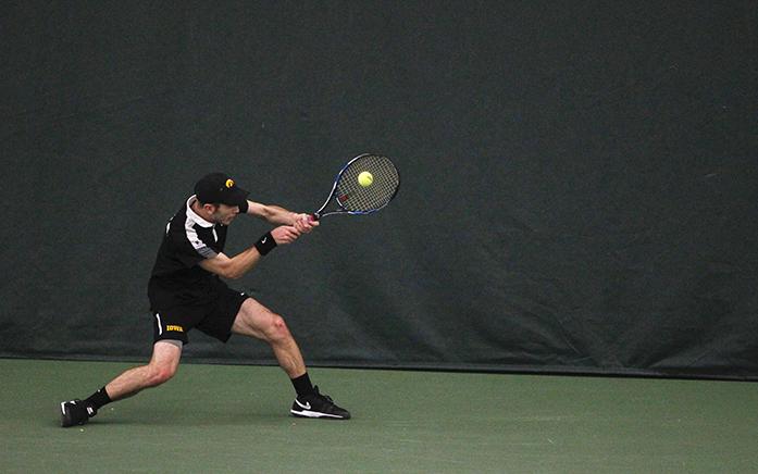 Iowas Jake Jacoby returns the ball during a match at the Hawkeye Tennis and Recreation Center on Friday, Mar. 11, 2016. Overall, Iowa lost to Nebraska 3-4. (The Daily Iowan/Ting Xuan Tan)