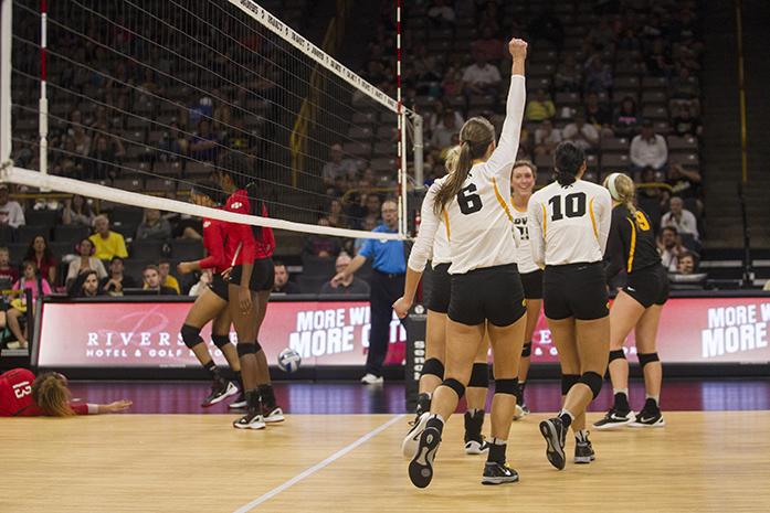 Iowa players celebrate after winning a point during a volleyball match at the Carver Hawkeye Arena in Iowa City on Friday, Sept. 16 , 2016. Iowa defeated Lamar 3-0. (The Daily Iowan/Ting Xuan Tan)