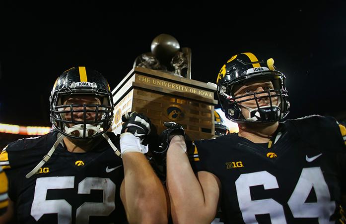 Iowas+Boone+Myers+and+Cole+Croston+carry+the+CyHawk+trophy+off+the+field+after+the+Iowa-Iowa+State+game+at+Kinnick+on+Saturday%2C+Sept.+10%2C+2016.+Iowa+head+Iowa+State+to+one+field+goal+to+defeated+them%2C+45-3.+%28The+Daily+Iowan%2FMargaret+Kispert%29